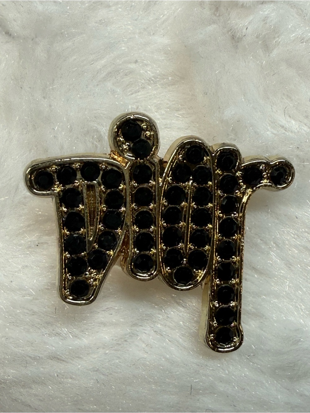 Gold-tone Charm with Black Stones